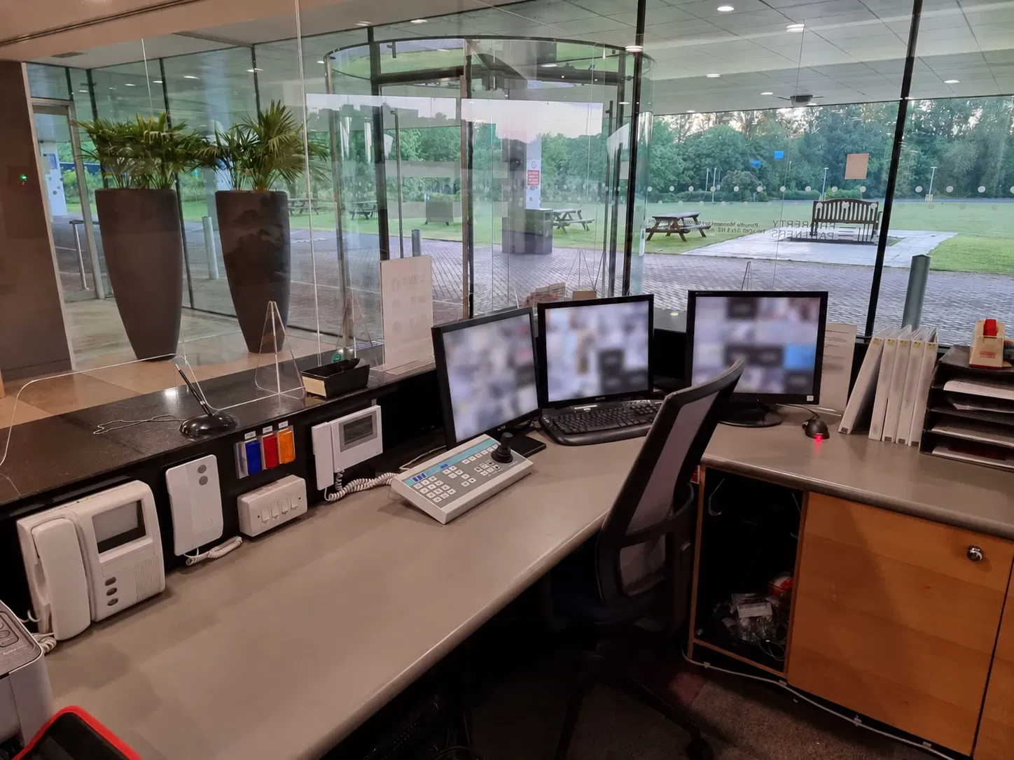 Multi-monitor CCTV control room with PTZ camera controller